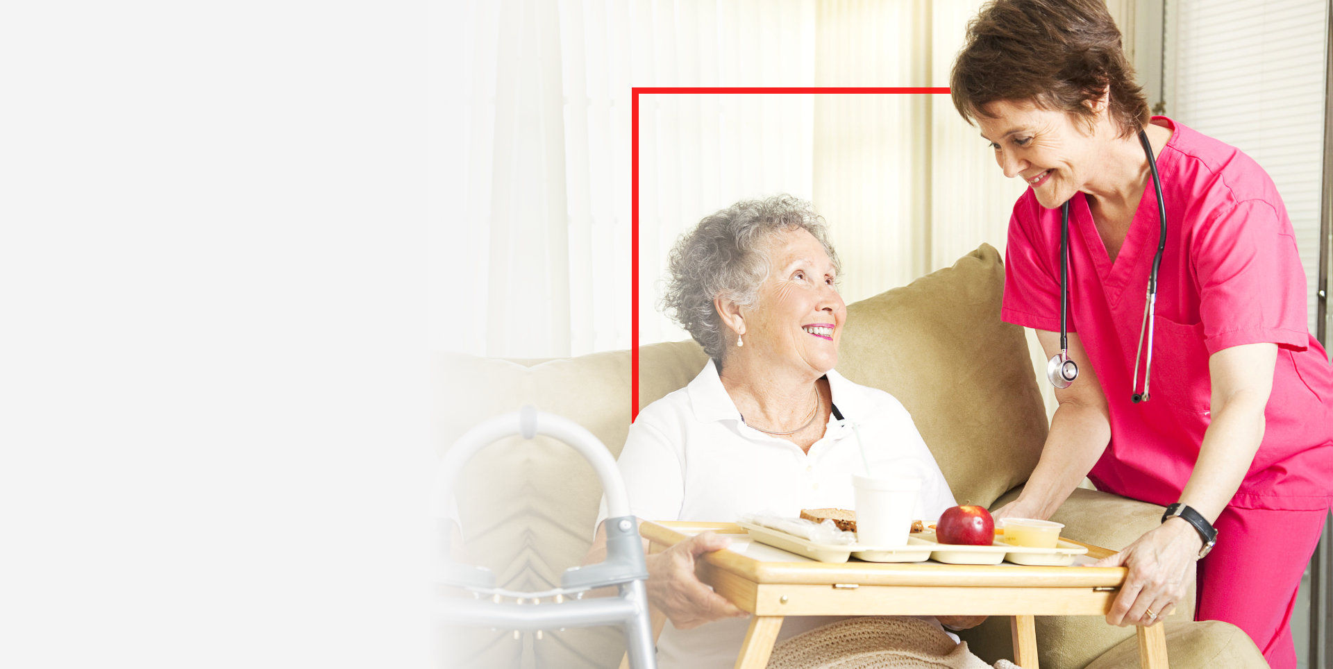 caregiver serving meal to the elder woman